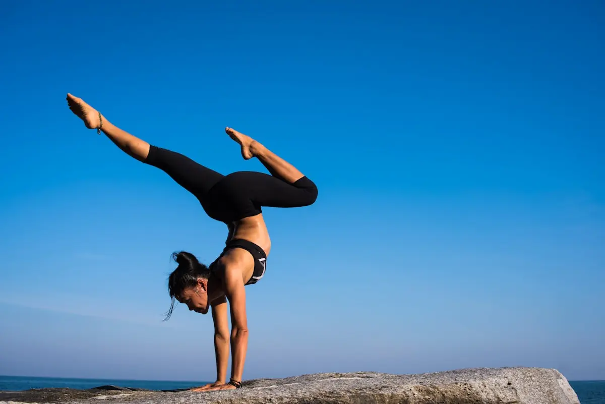 Woman holding a handstand outdoors